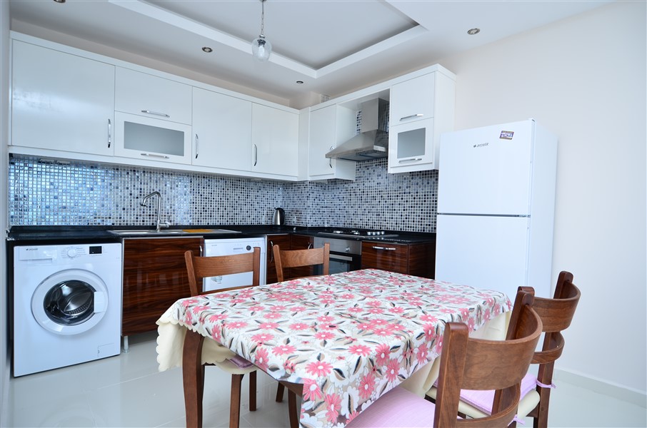 Апартаменты в Алании, Турция, 65 м² - фото 12